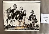 Front of 1936 AP Wirephoto showing four football players including Knute Rockne Jr.