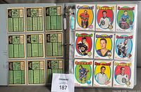 Binder page showing card backs and eight player front cards (Canadiens, Penguins, Rangers, Bruins, Kings, Black Hawks, Sabres, Red Wings)