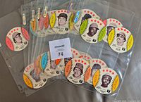 Stack of binder pages holding multiple Crane baseball discs