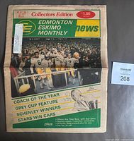 Front page showing title, graphics and price on folded newspaper