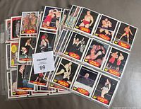 Spread of binder pages and loose stack showing multiple Series 2 WWF cards