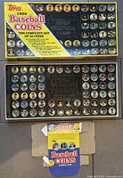 outer Topps box with lid open showing coin set and retail display box