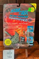 Front view of sealed Romulan Warbird playset on blister card