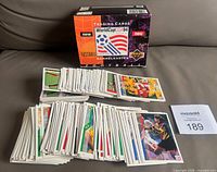 Cards spread out with empty wax box and MaxSold lot number visible