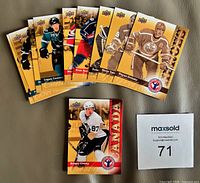Front view of fanned cards showing multiple players including Logan Couture and Sidney Crosby