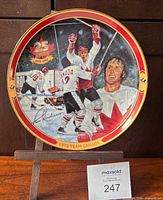 Front view of numbered collector plate showing artwork and border