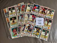 Multiple binder pages containing the 1981-82 Topps East hockey cards