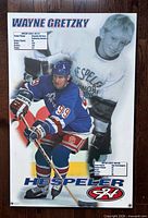 Front of laminated poster showing Gretzky action photo, childhood photo, stats and Hespeler logo