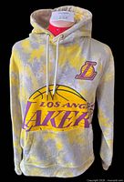 Front view of tie-dye Lakers hoodie showing graphics, hood and drawstring