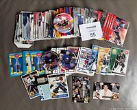 Stack of assorted hockey food issue cards and three round peanut butter lids