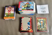 Stacks of World Cup insert cards, Looney Tunes subset, and Germany Excellence card in sleeve
