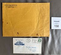 Fronts of both envelopes showing printed graphics, stamp, postmark and return address