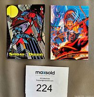 Two sample front images showing Spider-Man & Darkhawk and team battle art