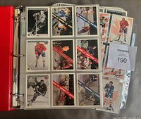 Open binder showing multiple nine-pocket pages with Original Six cards