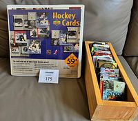 Binder front cover and wooden box filled with cards