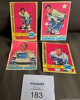 Group shot of all four signed Canucks replica cards