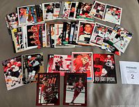 Top view of all 50 Eric Lindros cards spread out, showing variety of manufacturers and insert/numbered cards