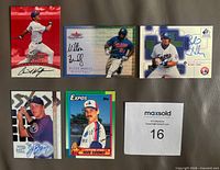 Fronts of five signed Montreal Expos cards plus lot ID slip
