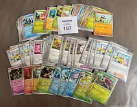 Full lot overview showing stacked sleeved cards and additional unsleeved cards