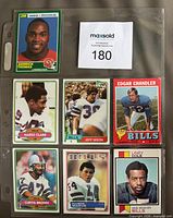 Front view of six cards in binder sleeve including Derrick Thomas rookie and five Bills cards