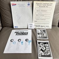 Overview of all five autograph items laid out on surface