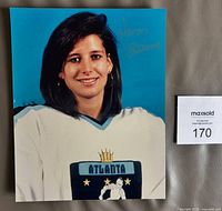 Full view of signed 8" x 10" photo with subject wearing Atlanta jersey