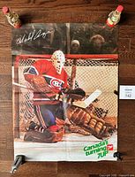 Full view of folded Michel Larocque 7-Up poster on floor with scale reference