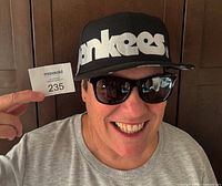 Cap worn on model showing front white Yankees script