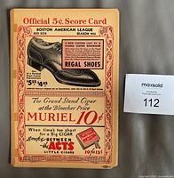 Front cover showing Official 5¢ Score Card, season 1935, advertising and MaxSold lot tag