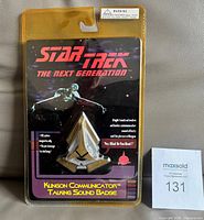 Front of sealed blister card showing badge and graphics