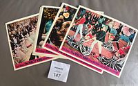 Stack of eight lobby cards with MaxSold lot tag visible