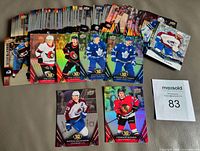 All 63 cards spread in stacks with several key cards displayed including Connor Bedard rookie