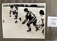 Front of vintage 8x10 Mark Howe WHA photo showing action scene and wear