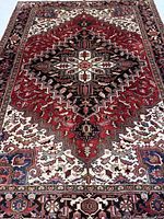 Full view of rug showing entire medallion pattern and borders