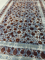 Full view of blue and brick red floral Kashan rug