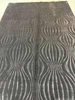 Full view of rug showing entire wave pattern