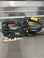 Black & Decker and Mastercraft corded jigsaws with cords coiled
