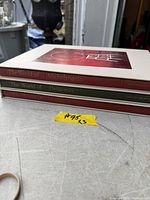 Spines of Michelangelo and Delacroix volumes plus top edge of Duchamp volume