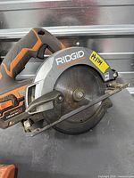 Left side view of RIDGID 18V circular saw showing blade and model markings