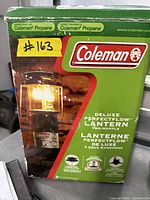 Front of box showing Coleman Deluxe PerfectFlow propane two-mantle lantern