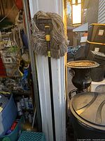 Full view of mop showing handle, clamp head and mop yarns