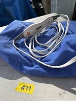 Blue A Life heating pad with attached white 3-setting controller, lot sticker visible