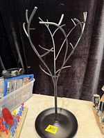 Full view of Umbra black metal jewelry tree stand