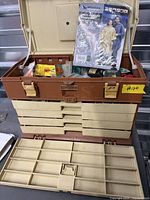 Overall view of open Plano tackle box with contents visible