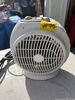Front view of portable electric heater showing grille and overall design