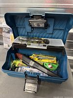 Overall view of blue tackle box open with contents and integrated lights visible