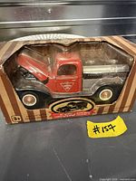 Front view of boxed die-cast Ford pickup truck model