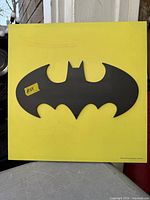 Front view of Batman wall art showing logo and overall condition