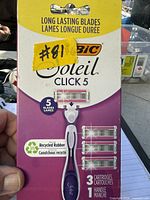 Front of sealed retail package showing BIC Soleil Click 5 razor handle and three refill cartridges