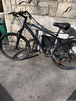 Full left-side view of CCM mountain bike showing frame, wheels, seat, handlebars